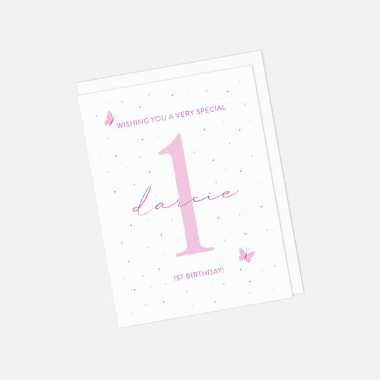 Birthday card with pink number '1' and text on a white background