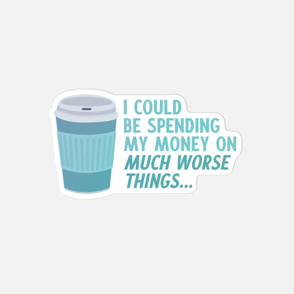 Sticker with a blue coffee cup and humorous text on a light gray background