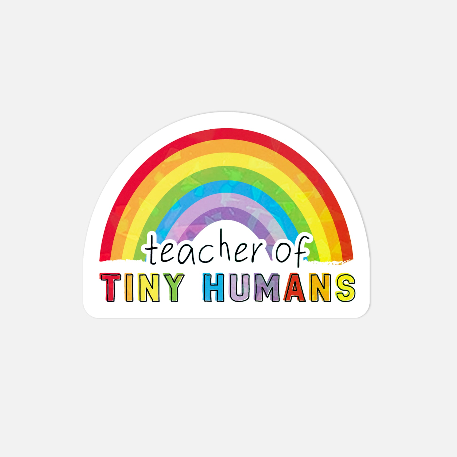 Sticker with rainbow and 'teacher of tiny humans' text on a white background