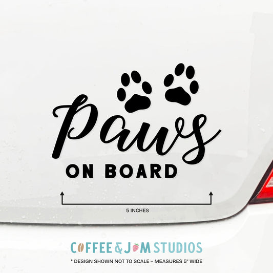 Car decal with 'Paws on Board' text and paw prints on a white car background